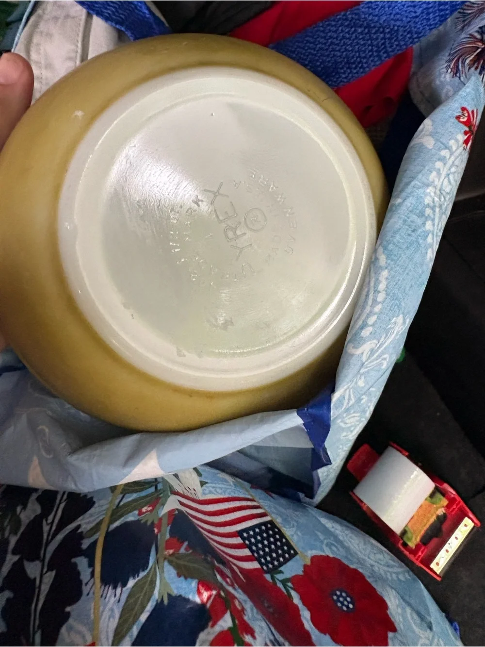 Pyrex Americana mixing bowl in a gold color.